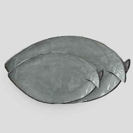 Blue fish-shaped serving plate.